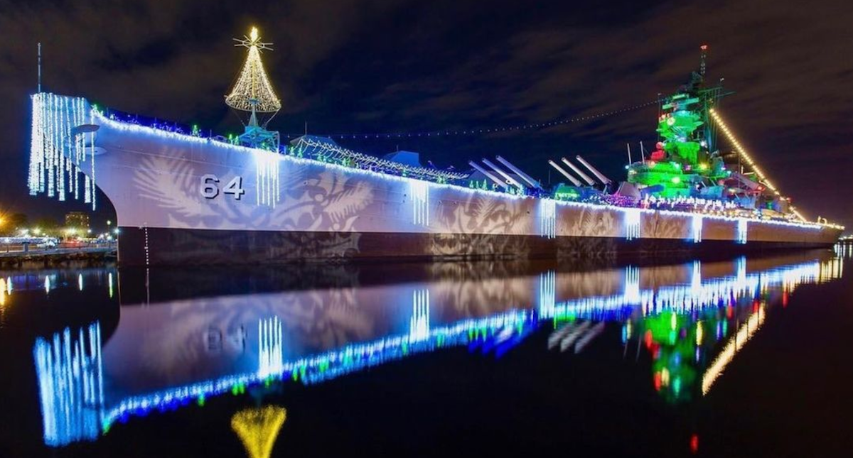 Night view of the battleship USS Wisconsin in holiday dress